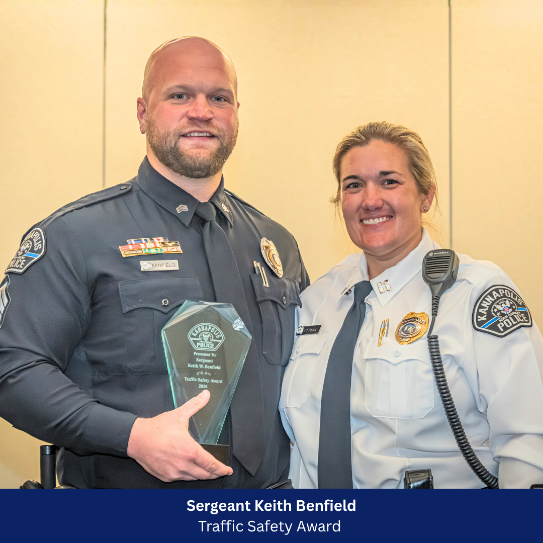 Sargent Benfield receiving award from Captain Clarke 